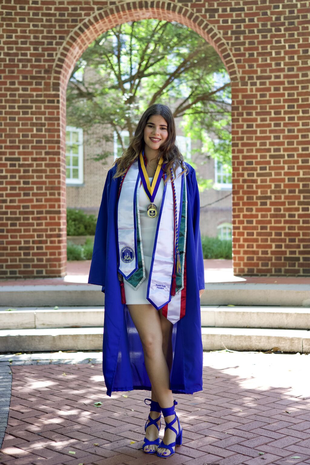 Julia Hatoum in cap and gown at her University of Delaware graduation